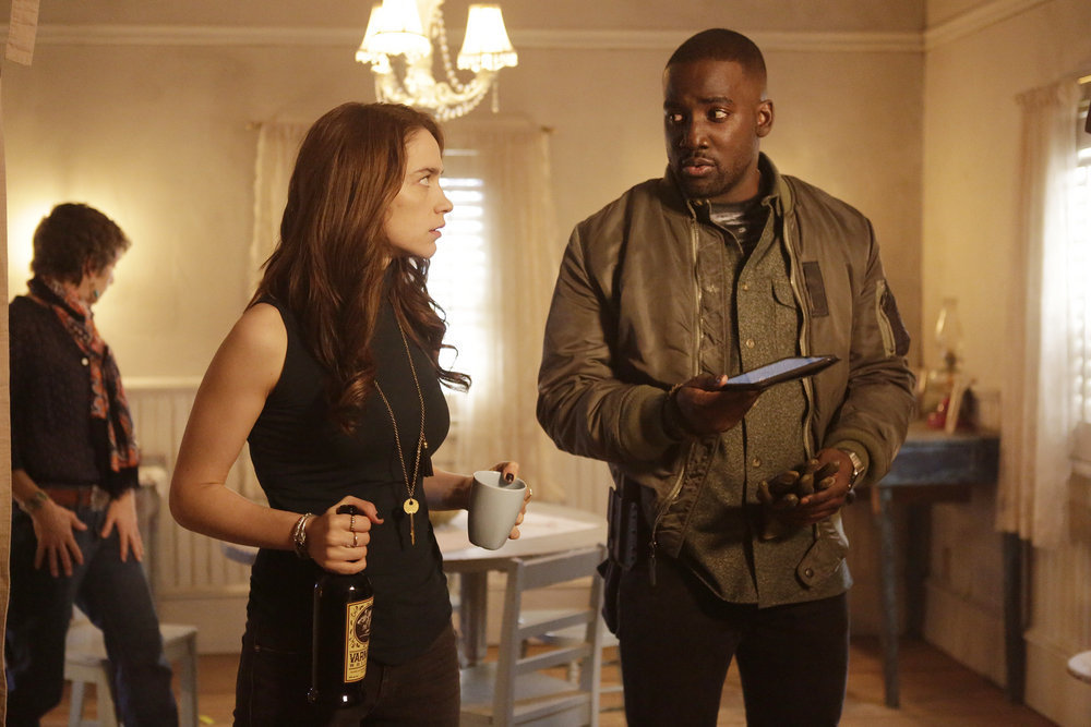 WYNONNA EARP -- "Landslide" Episode 111 -- Pictured: (l-r) Melanie Scrofono as Wynonna Earp, Shamier Anderson as Agent Dolls -- (Photo by: Michelle Faye/Syfy/Wynonna Earp Productions)