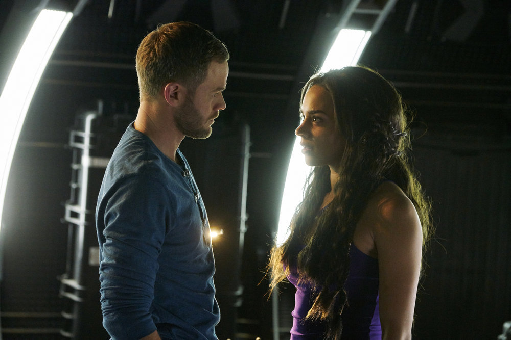 KILLJOYS -- "Meet The Parents" Episode 205 -- Pictured: (l-r) Aaron Ashmore as John, Hannah John-Kamen as Dutch -- (Photo by: Steve Wilkie/Syfy/Killjoys II Productions Limited)