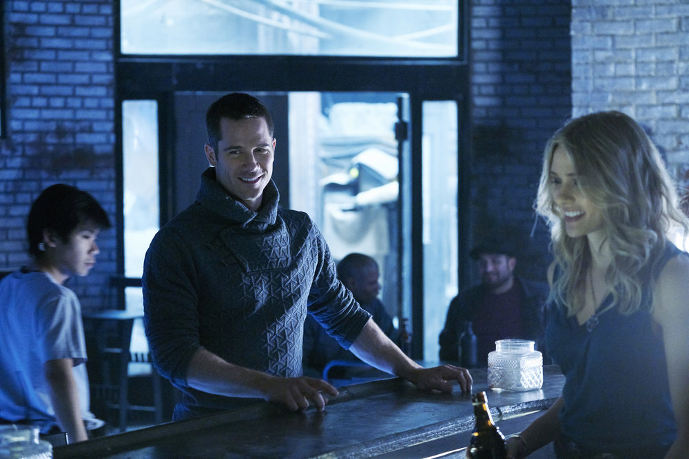 KILLJOYS -- "Meet The Parents" Episode 205 -- Pictured: (l-r) Luke Macfarlane as D'avin, Tori Anderson as Sabine -- (Photo by: Steve Wilkie/Syfy/Killjoys II Productions Limited)