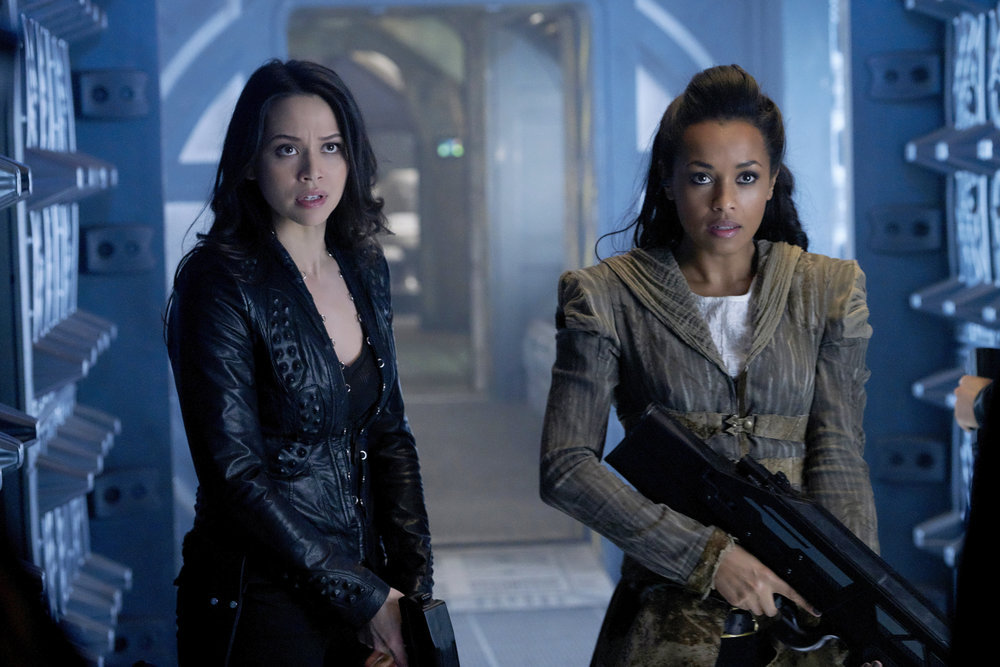 DARK MATTER -- "We Should Have Seen This Coming" Episode 206 -- Pictured: (l-r) Melissa O'Neil as Two, Melanie Liburd as Nyx -- (Photo by: Steve Wilkie/Prodigy Pictures/Syfy)